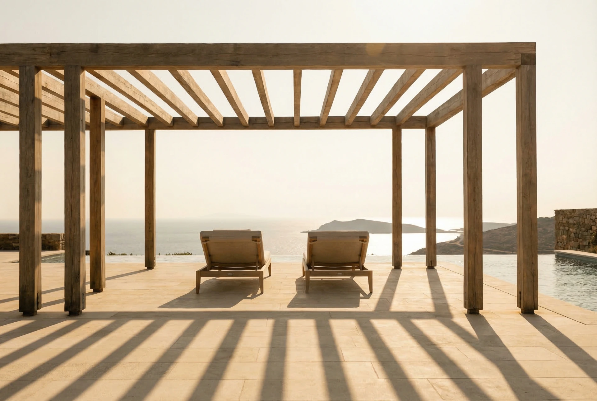Wooden pergola casting geometric shadows on stone terrace at golden hour