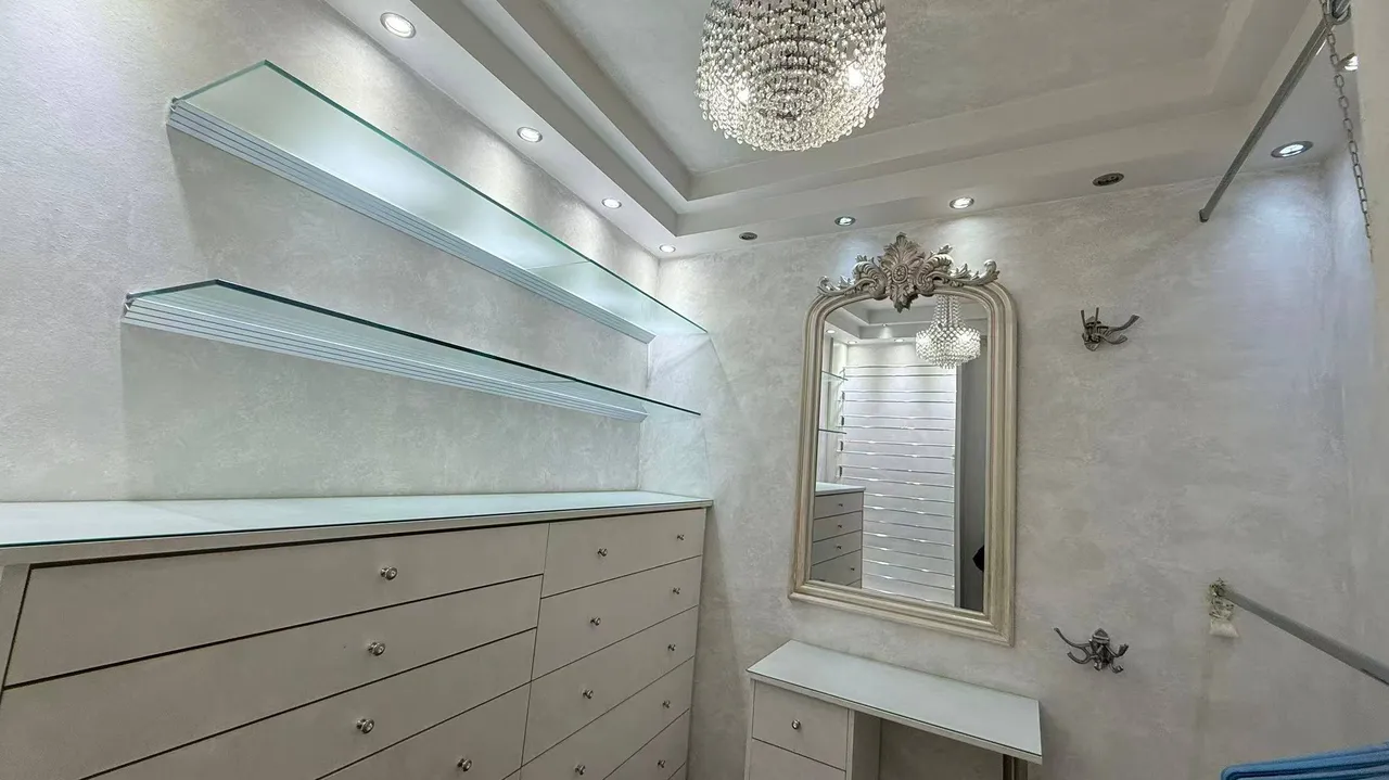 Walk-in closet with baroque mirror