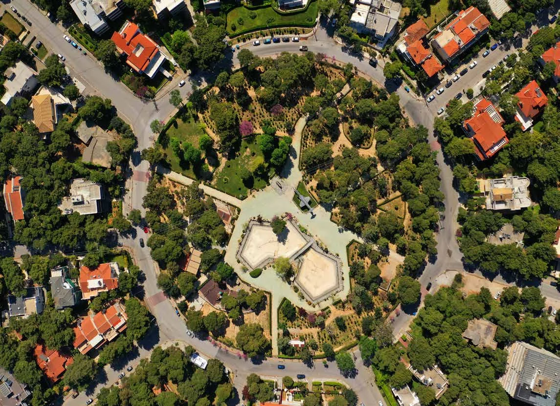 Aerial view of a circular park and surrounding streets